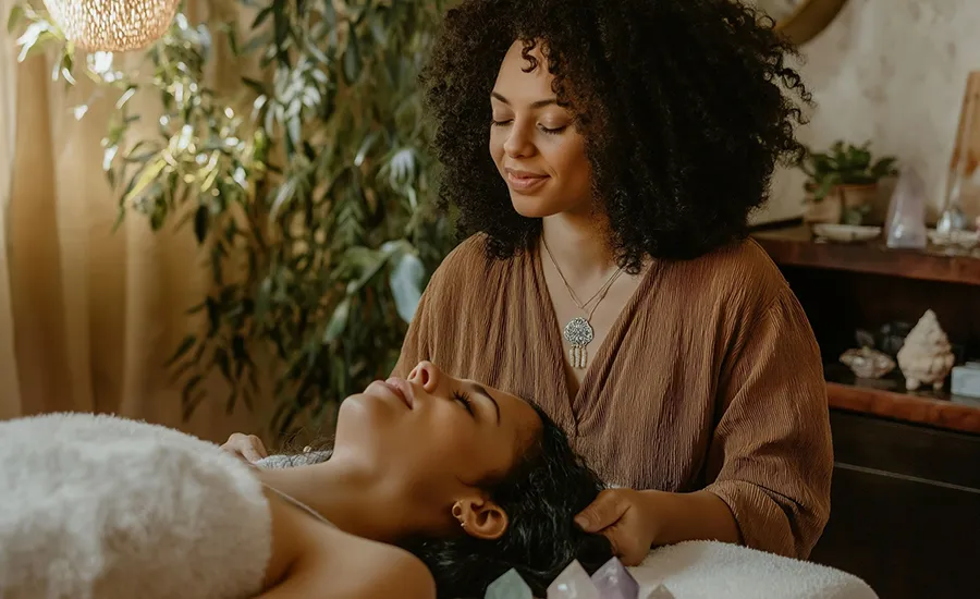 Makeup artist providing a facial treatment to a client
