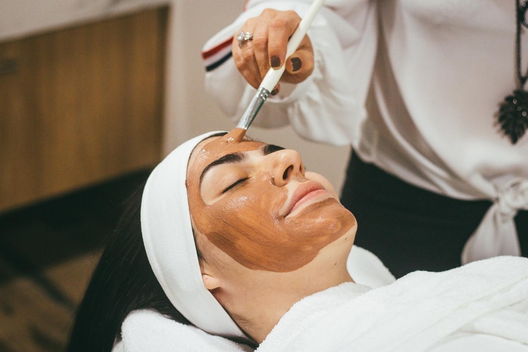 Professional facial treatment being applied during a BrowBone skincare service